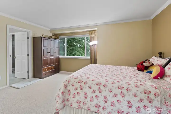 Take in the spaciousness of this elegant primary bedroom—room for relaxation, work, and everything in between!