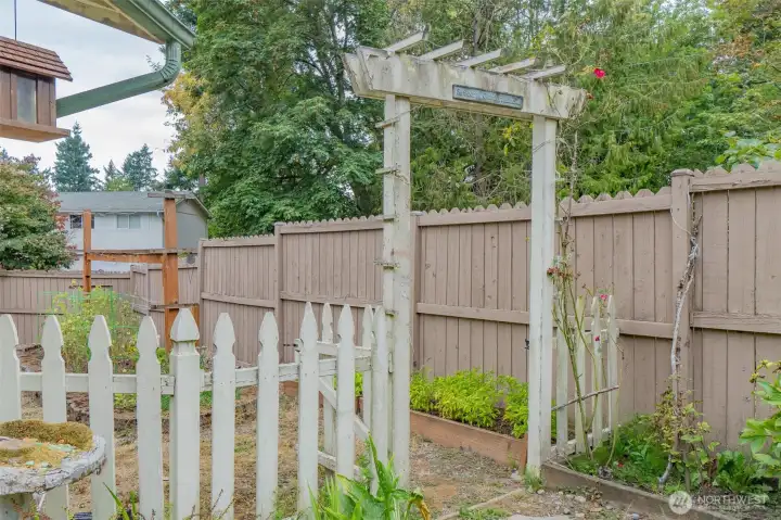 The backyard offers a tucked-away space ideal for a dog run, RV parking, or extra storage—versatile and convenient for your needs.