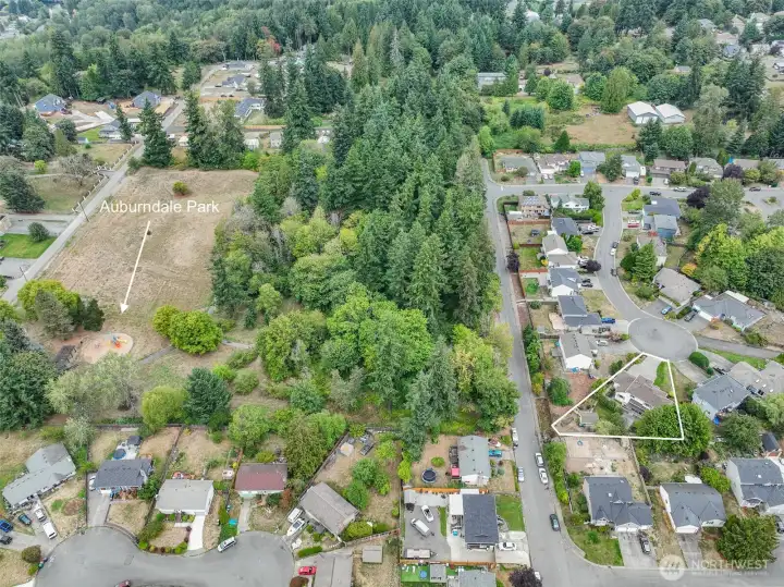 Take a look at the backyard view—Auburndale Park is right behind the house, offering green space and endless outdoor fun just steps from your door.