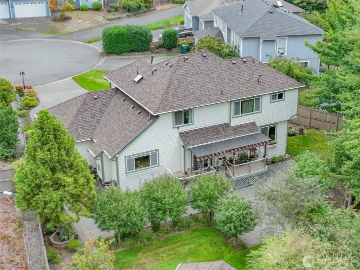 The home features a newer roof equipped with leaf guards, combining durability with low-maintenance convenience.