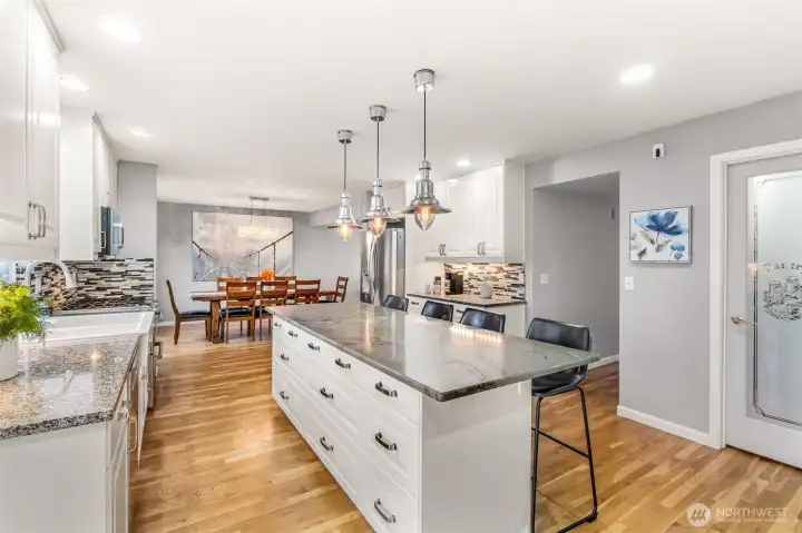 Kitchen with dining room behind it