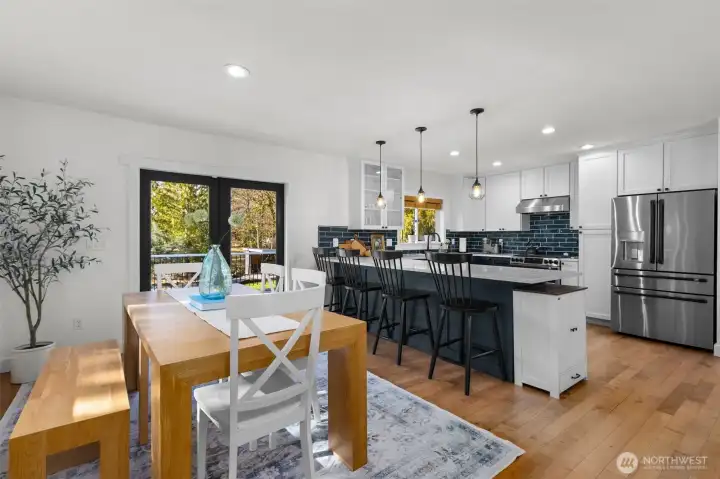 bright and sunny dining area, breakfast bar and open kitchen