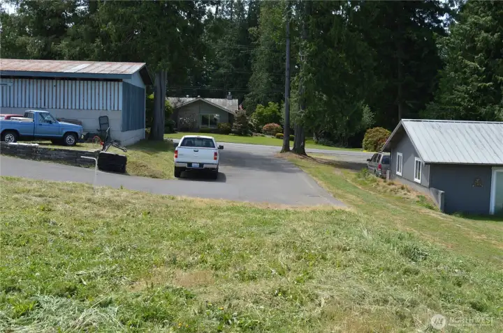 Looking down the shared driveway to Kamm Rd. Building site sits back from the main road.