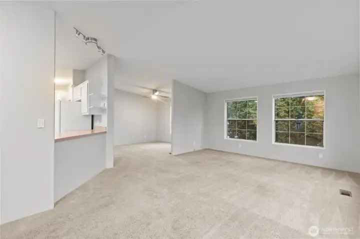 The layout of the front of the home is perfect with vaulted ceilings and oversized windows offering a lot of natural southern exposure.  The entire home has been freshly painted in an updated color and ceilings were all painted white.  Fresh paint has given this space a new look and very updated feel!  The Dining Room has its own dedicated space, separate from the Living Room.  Either way, it feels like a Great Room when you are there and the open concept of this part of the home was deisgned to keep people together.