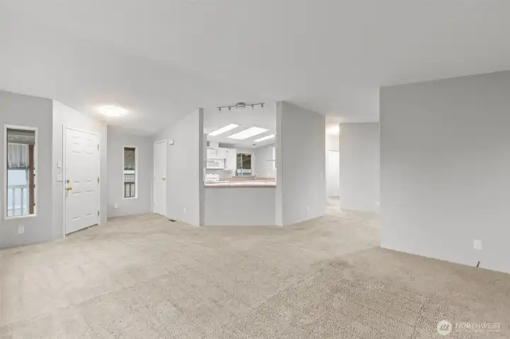 Big, beautiful Living Room, nicely flows through the Dining Room and around to the Kitchen. There is plenty of space for an entryway table next to the coat closet and you can see everything right away upon entry, except anyone in the kitchen with their hands in the cookie jar - you can't see them as you're walking in.  The updated lighting has a brushed nickel finish and brings just the right touch to this canvas.