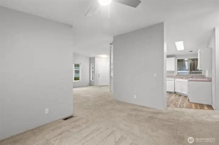 There is something about a white ceiling along with a cool (Agreeable Gray) wall color that just seems to raise the ceiling a little bit higher.  Spaces like these are built for almost ANY kind of furniture.  Wide walkways and hallways allow for easy transition from one space to the next!