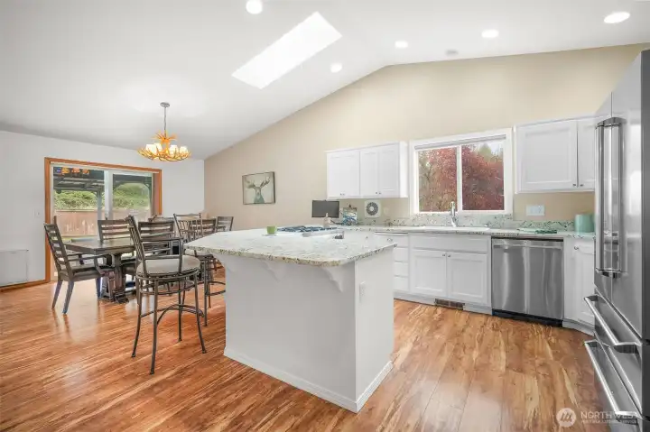 Open-concept great room designed for connection and comfort with seamless flow to kitchen and dining.