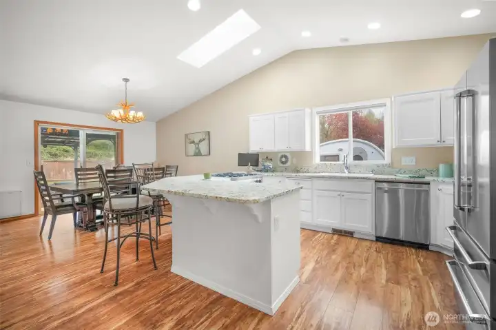 Open-concept great room designed for connection and comfort with seamless flow to kitchen and dining.