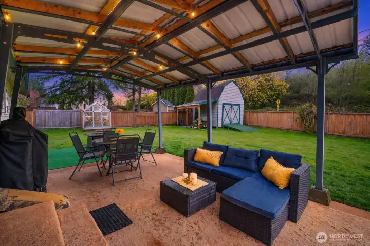 Stamped concrete covered patio creates the perfect year-round outdoor living space—rain or shine.