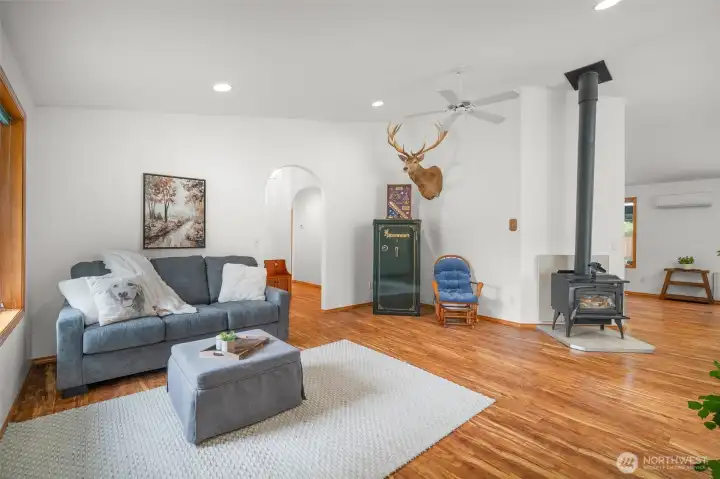 Cozy living room with wood stove—ideal for warm, inviting nights at home.