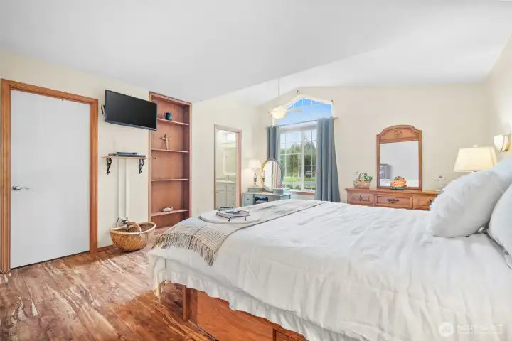 Oversized primary retreat with walk-in closet and jetted tub for a spa-like feel.