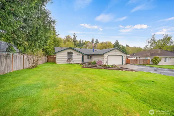 Manicured landscaping welcomes you home with great curb appeal and a well-kept feel.