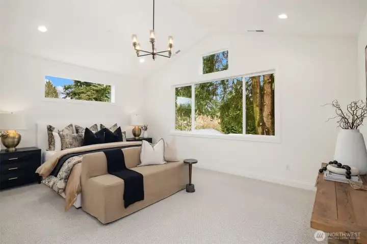 Designer primary suite with five-piece bath and heated floors