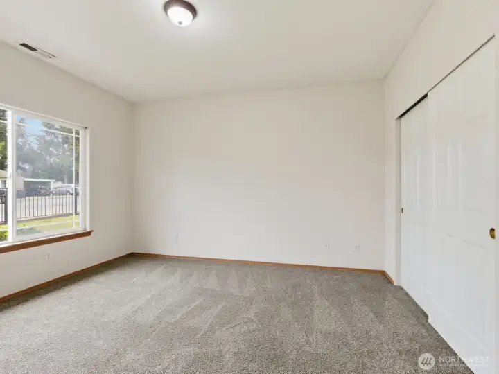 The primary bedroom is a great size with a large closet and access to the bathroom. The primary bedroom is a great size with a large closet and access to the bathroom.