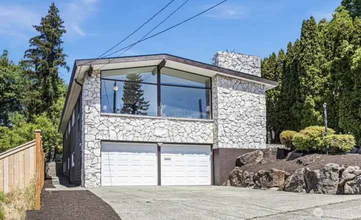 1965. Stone. Glass. Still the most interesting house on the block.