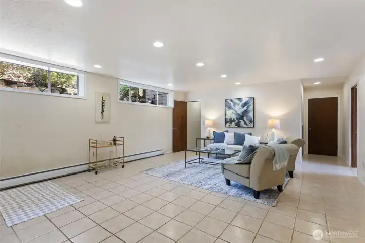 The rec room keeps going — and so do the options. Extended living, multigenerational rhythm, rental potential — the layout makes the questions feel practical. Buyer to verify all uses and permitting.