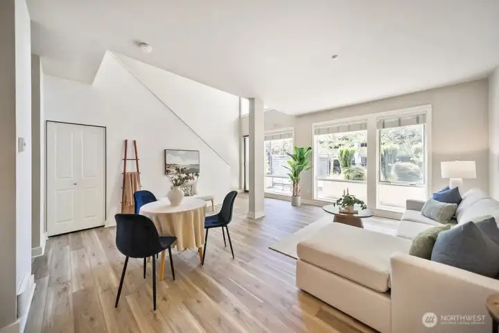 Looking into main living area from the kitchen. I love the oversized windows and natural lighting.