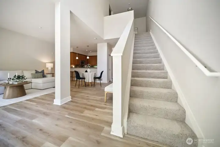 Stairs to primary bedroom, full bath, laundry closet with washer& dryer to convey and a micro office landing area.