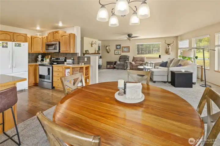 A seamless connection between kitchen, dining, and living spaces. A seamless connection between kitchen, dining, and living spaces.