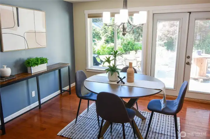 Breakfast nook with french doors that lead to the patio and fenced back yard.