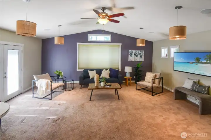 Fabulous large TV / rec room with french doors that open to the back patio and yard. Enjoy vaulted ceilings, ceiling fan and space for your sports watching parties.