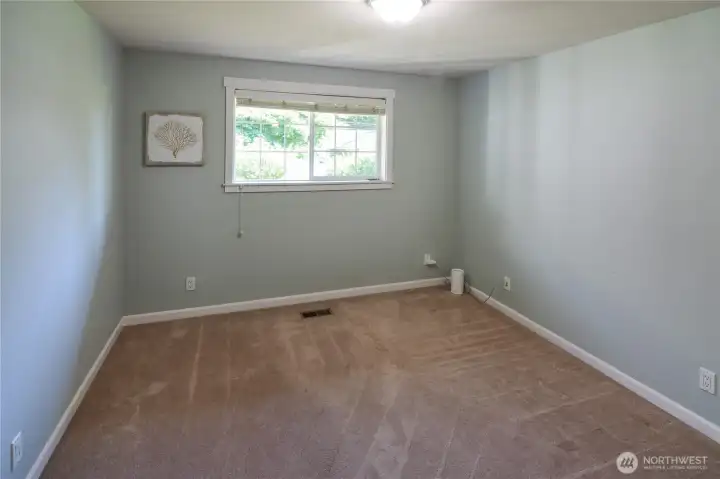 2nd of 4 bedrooms is standard size with window and closet.
