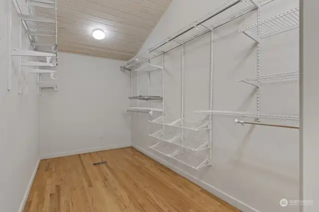 Buy the shoes! This walk-in closet in the primary bedroom has space for all of your favorite pieces.