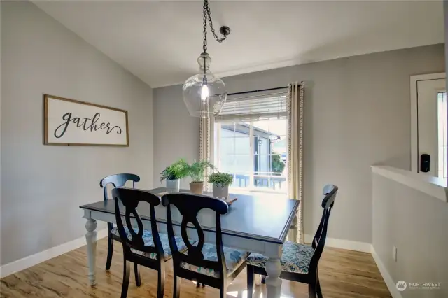 Dining room with vaulted ceiling.