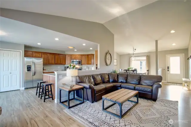 Great room looking to kitchen area and formal dining room.