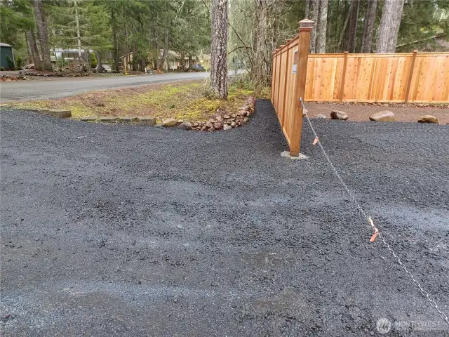 Front left wall and walk in front of fence