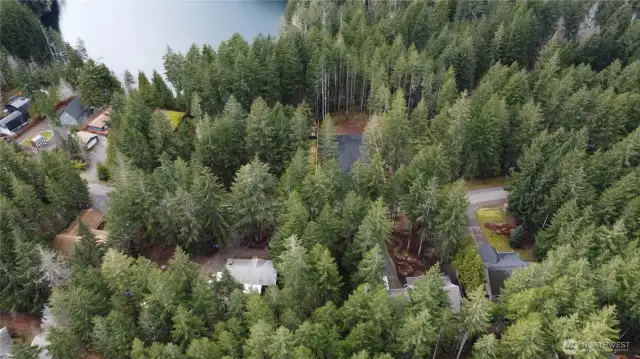 Arial drone close up with lot and partial lake