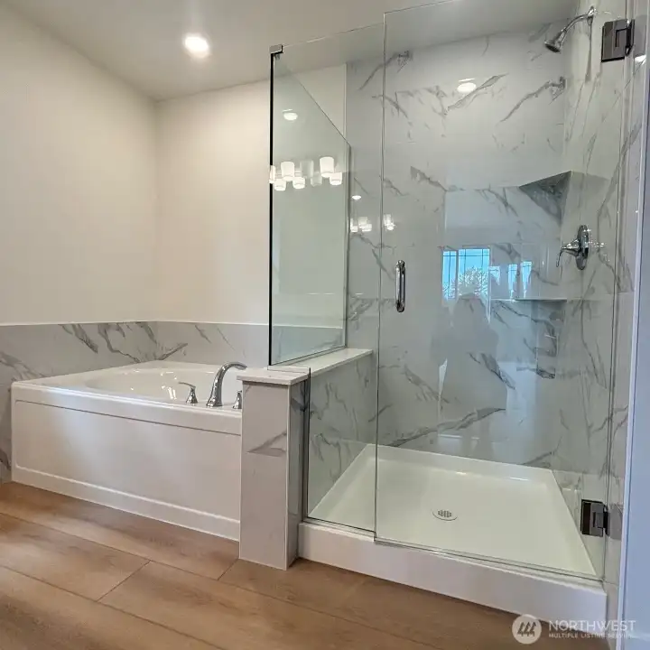 Primary shower + relaxing soaker tub