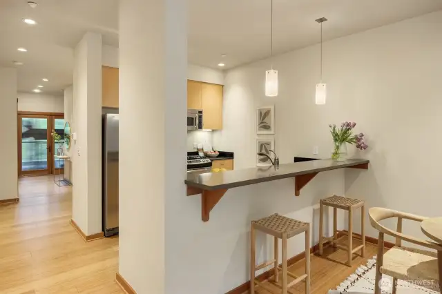 The bar area provides a space for guests to sit and the chef is at work, and also hides the mess so the happy host can enjoy their company and save the tidying-up for later.