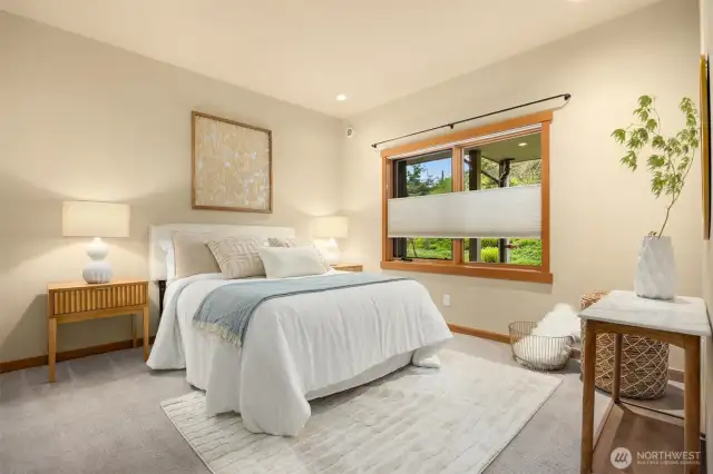 The spacious bedroom boasts bottom-up/top-down blinds to allow privacy but keep the room bright and cheery. The next owner’s choice of curtains can also darken the room, if desired (last set removed for sale).