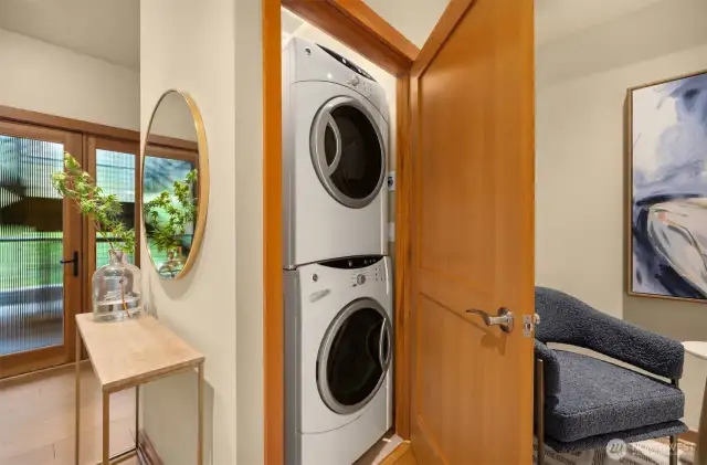 The laundry closet off the flex space holds full-size stacking washer and dryer, both of which convey to the next owners.