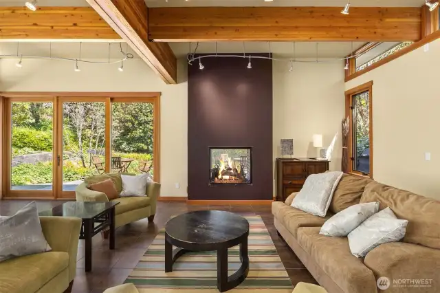Here, we see comfy, oversized seating in the Fireside Room for days when it too cool on the other side of the double-sided fireplace.