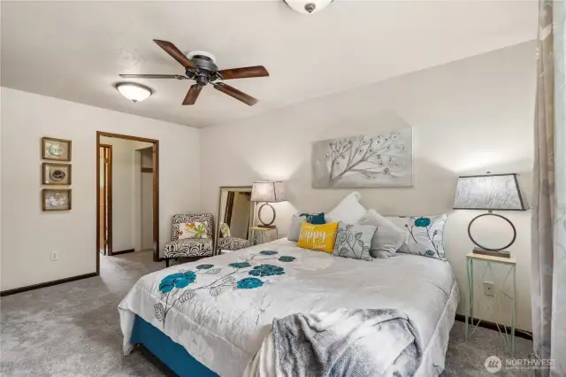 Primary bedroom, walkthrough closet into bathroom, full bathroom. Note behind mirror entry to additional storage space.