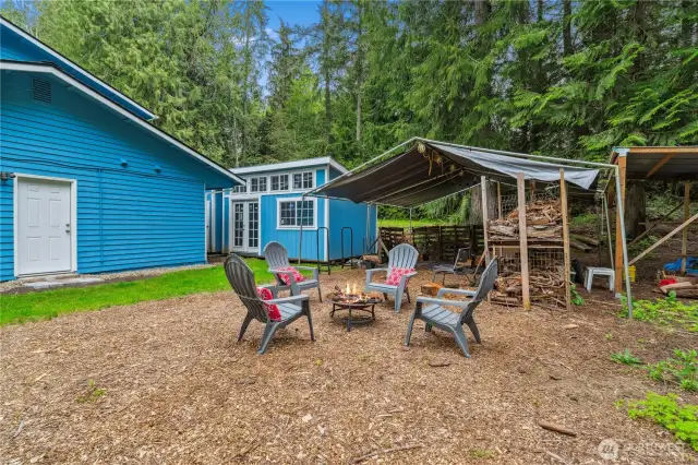 Side entrance leads into large bonus room with attached 2nd bathroom with a vanity and tub/shower too! Visual of one of the two side-by-side out buildings, this one has windows, great for a potential Art Studio, hobby room, play house?