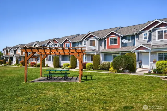 Common area in front of home with gazebo picnic area.