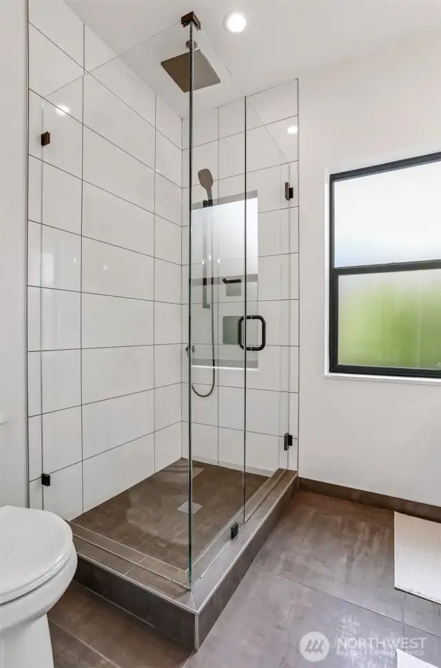 Luxury Shower with Stone Floor, Rain Head, Handheld and Full Glass Enclosure