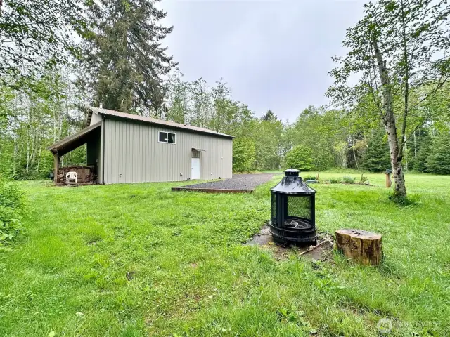 Leantoo for firewood and tractor storage.