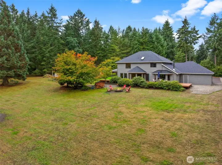 Property - Endless possibilities in this expansive backyard with a koi pond, greenhouse, chicken coop, and open space for play or entertaining. Perfect for family gatherings, gardening, or enjoying peaceful moments surrounded by nature.