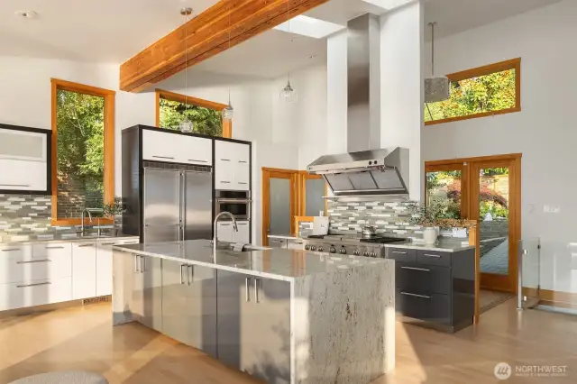 The kitchen enjoys great prep space, additional storage in the walk-in pantry.