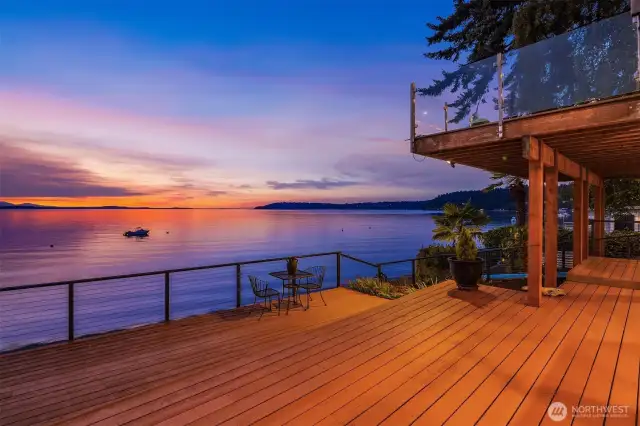 From this level, one enjoys a second tier of deck perfect for entertaining, sunbathing and lounging.