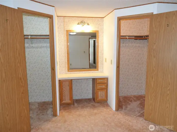 Master Bedroom vanity, and dual walk-in closets.