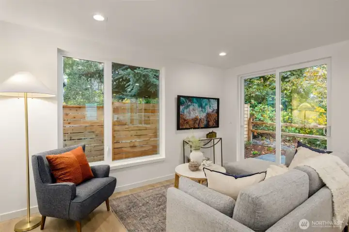 Find a cozy living room with greenbelt view on the main living level