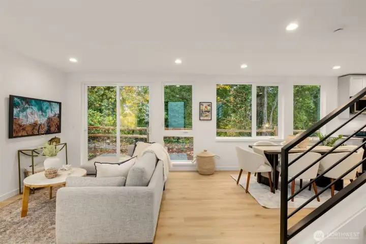 A wall of windows keeps the ground level bright and feeling open