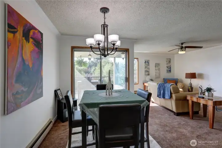 Nice dining area is convenient to the kitchen and the deck.