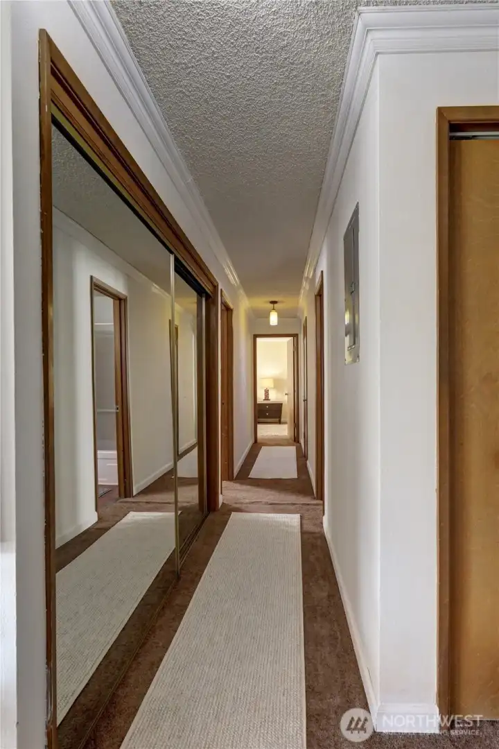Hallway leading to the bedrooms and bathrooms.
