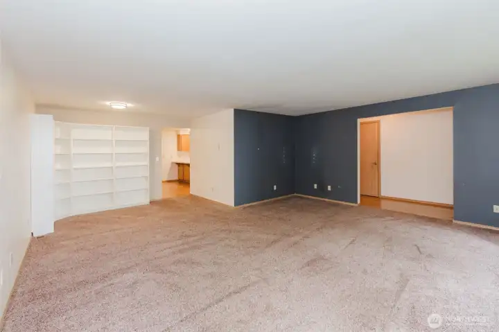 Opposite angle of the living room with book shelves